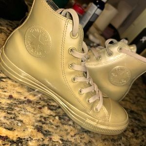 Gold high-top women’s Converse  size 8. . Made of rubber so they are waterproof